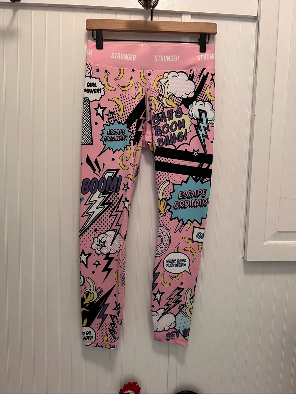 Stronger Punch Leggings, featuring a vibrant pink, retro pop art and comic book